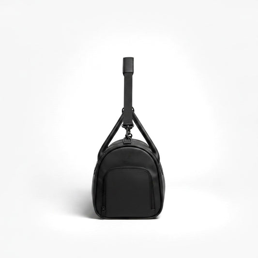 The YOUNfit Leather Handle Duffel in black vegan leather — detail view